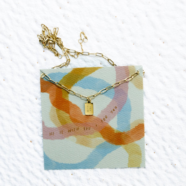 paperclip necklace with tag pendant that says With You