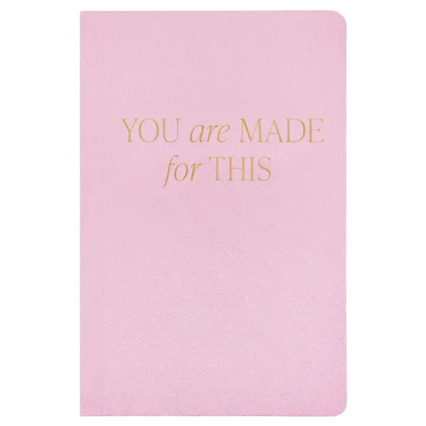 Pink notebook with gold text 'You are made for this' on a white background